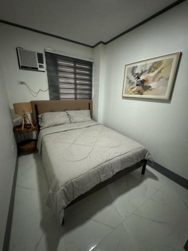 Postel nebo postele na pokoji v ubytování MDEC Apartments