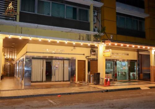 a building with lights on the side of a street at DarulMakmur Scout Lodge in Kuantan