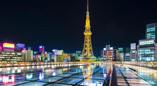 a view of the eiffel tower at night at Daini Fuji Hotel in Nagoya