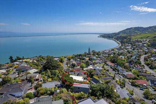 an aerial view of a town next to a body of water at Sea Tide Views - Atawhai in Nelson