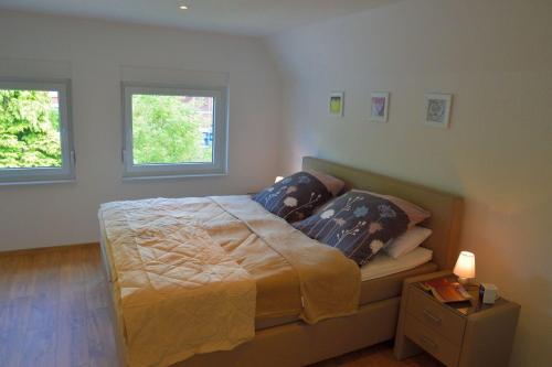 Ένα ή περισσότερα κρεβάτια σε δωμάτιο στο Stadtidyll