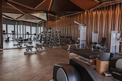 a gym with treadmills and exercise equipment in it at Luxury Condo Edge Central Pattaya in Pattaya