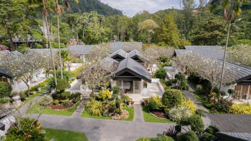 an aerial view of a house with a garden at Thavorn Beach Village Resort & Spa Phuket in Kamala Beach