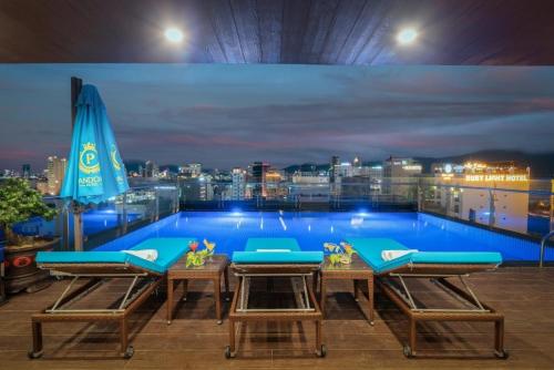 a swimming pool on the roof of a building at Sana Da Nang Beach Hotel in Da Nang