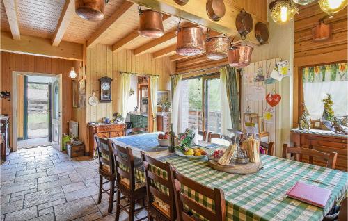 a kitchen and dining room with a table and chairs at Amazing Apartment In Borno With Kitchen in Borno