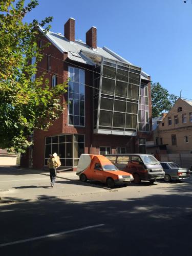 a person walking down a street in front of a building at Newport in Dnipro