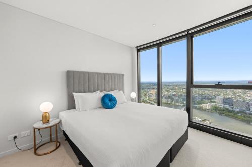 Voodi või voodid majutusasutuse Brisbane Skytower by CLLIX toas
