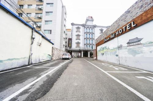 an empty street in a city with a building at Dreamhill motel in Gyeongju