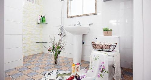 a bathroom with a sink and a toilet in it at Gyeongju Princess in Gyeongju