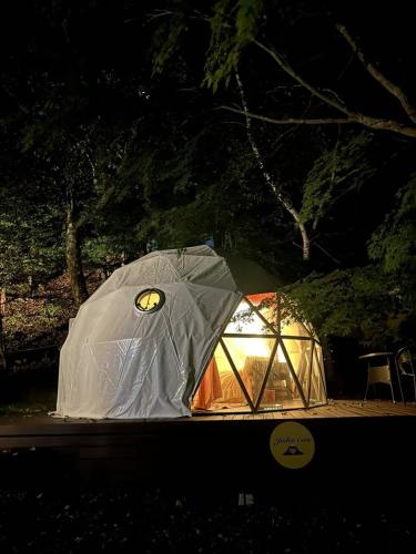 a tent is set up in the dark at 愛犬と泊まるグランピングJuden Camp Fuji in Yamanakako