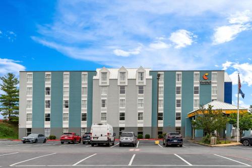 a large building with cars parked in a parking lot at Comfort Inn & Suites Staunton in Staunton