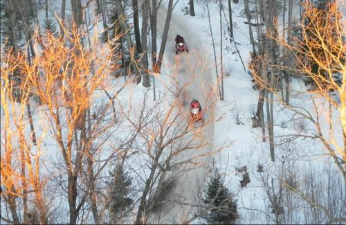 an overhead view of two people walking in the snow at Kids under 4 free, Jacuzzi, Sauna, Pool, Lake, Gym in Albrightsville