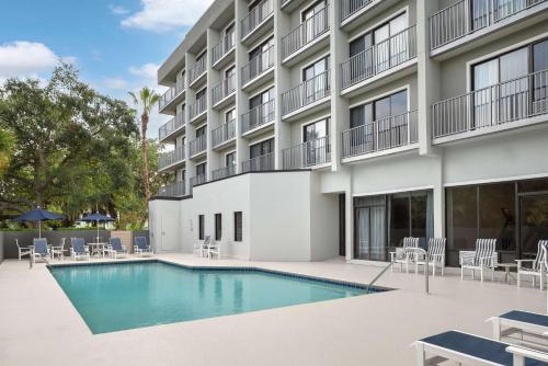 a swimming pool in front of a building at DoubleTree by Hilton Hilton Head Island in Hilton Head Island