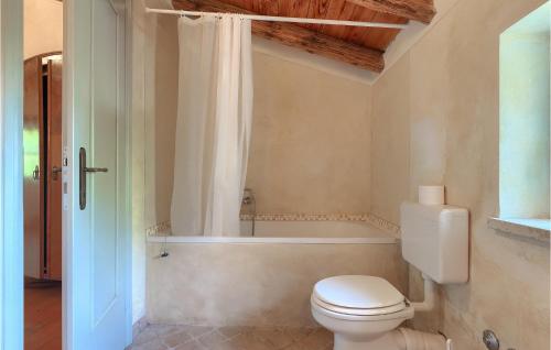 a bathroom with a toilet and a bath tub at Villa Roveria in Butkovići