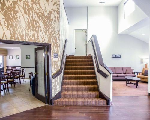 a stairway in a building with a lobby at Sleep Inn Tinley Park I-80 near Amphitheatre-Convention Center in Tinley Park