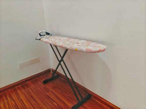 a shelf in the corner of a room with at Setia Alam Convention Center Spacious House in Shah Alam