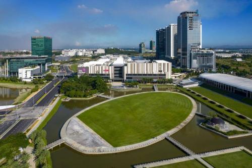 a view of a city with a river and buildings at Setia Alam Convention Center Spacious House in Shah Alam
