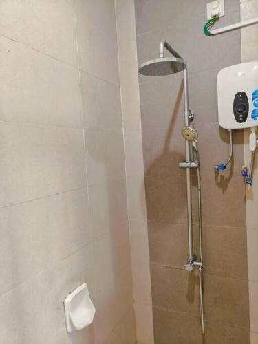 a bathroom with a shower with a toilet at Setia Alam Convention Center Spacious House in Shah Alam