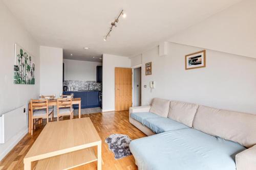 a living room with a couch and a table at Large 2 Bed 2 Bath Central Manchester in Manchester