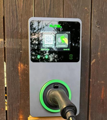 a pay meter with a hose plugged into it at ALMNEST - LACHTAL in Lachtal