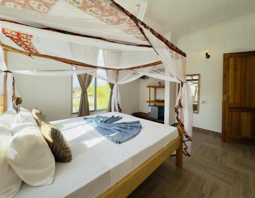 Katil atau katil-katil dalam bilik di Shirley Residence Kiwengwa