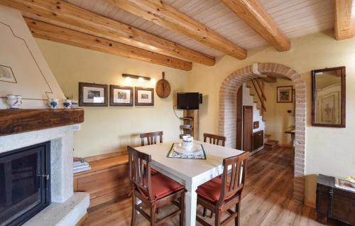 a living room with a table and a fireplace at Alla Cocca in San Donato