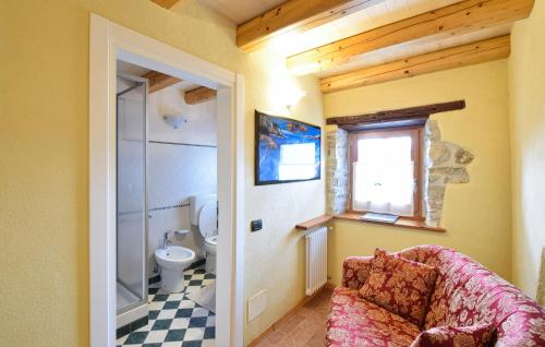 a bathroom with a toilet and a sink at Alla Cocca in San Donato