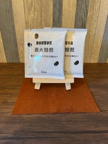 a box with a sign on top of a table at Cycle Guest House SHIOKAZE in Setoda