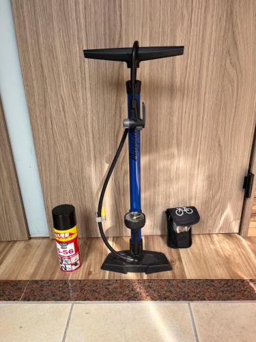 a bat stand on the floor in front of a door at Cycle Guest House SHIOKAZE in Setoda