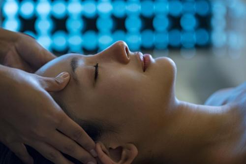 a woman getting a back massage at Novus Jiva Anyer in Anyer