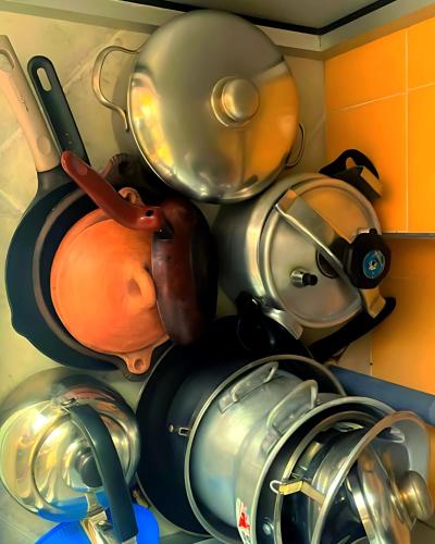 a bunch of pots and pans in a kitchen at Beach View Apartment Oued Laou in Oued Laou