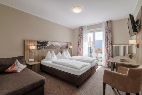 Postel nebo postele na pokoji v ubytování Hotel Mitlechnerhof