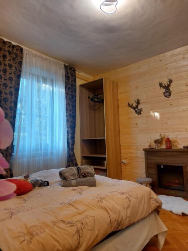 a bedroom with a large bed and a fireplace at APPARTAMENTO CHEMIN DE FER in Saint Vincent