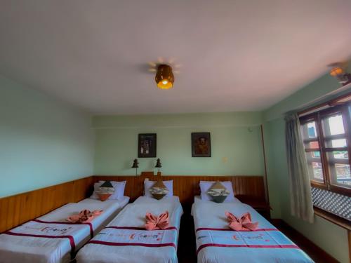 Cama o camas de una habitación en New Shiva Guest House
