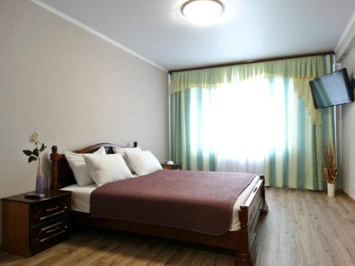 Krevet ili kreveti u jedinici u objektu Inndays Apartments na Lunacharskogo