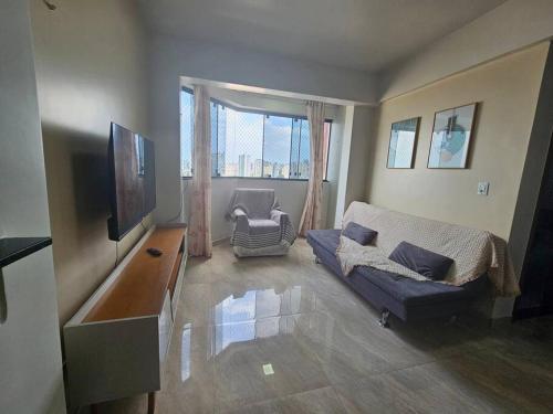 Et opholdsområde på Apto Confortável com 2 quartos em Batista Campos