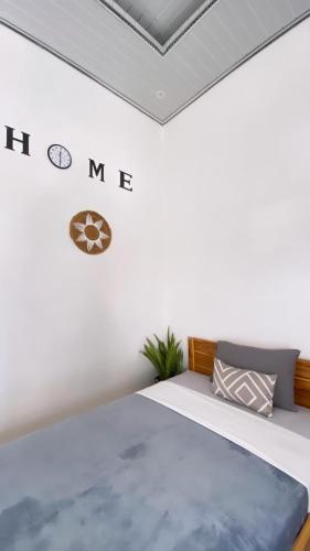 Ένα ή περισσότερα κρεβάτια σε δωμάτιο στο Juliana HomeStay