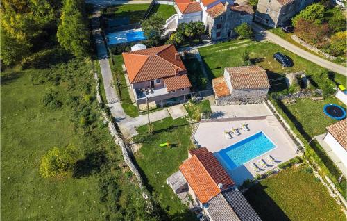 an overhead view of a house with a swimming pool at Villa Mendula in Potpićan