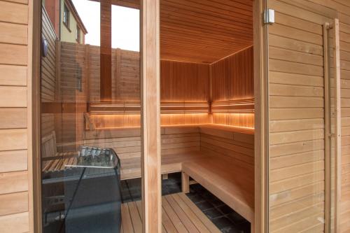 a sauna with a bench in the middle at Apartmán na Sportovním areálu in Krásná Lípa