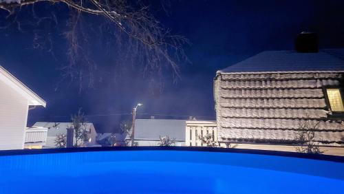 a view of a building at night with at The Perfect Stop - Pinewood Loft in Lødingen