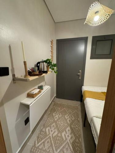 a room with a bedroom with a bed and a door at Small details1 Self-check-in in Riyadh