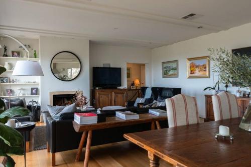 a living room with a couch and a table at Bayview Farm Bashams in Port Elliot