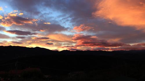 a sunset with clouds in the sky at Casa vacanze Ester in Polverara