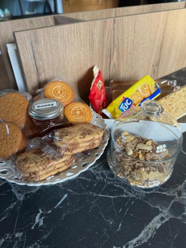 a box of cookies and other snacks on a counter at Appartamento con giardino in Pontecchio
