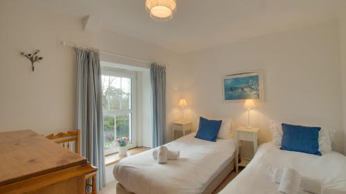 Voodi või voodid majutusasutuse Robin Cottage toas