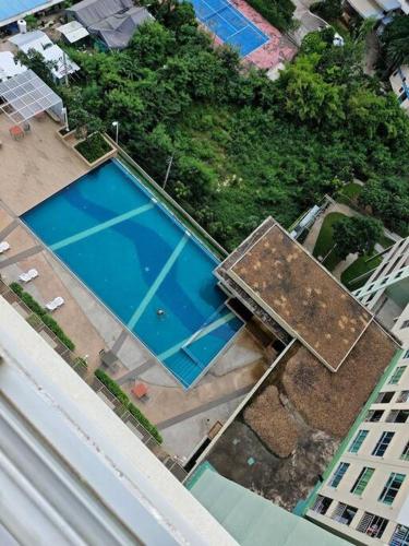 an overhead view of a swimming pool on top of a building at LumpiniC17 in North Pattaya