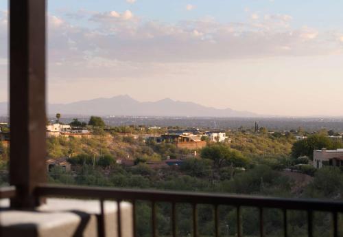 a view of a city from a balcony at Embassy Suites Tucson - Paloma Village in Tucson
