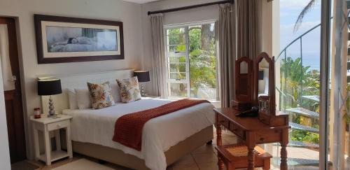 Ένα ή περισσότερα κρεβάτια σε δωμάτιο στο Blue Water Bay Holiday Apartment
