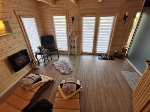 an overhead view of a living room with a couch and a fireplace at Wohnung Balko in Simmerath