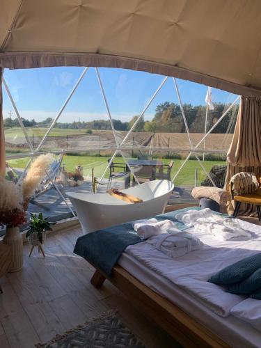 Postel nebo postele na pokoji v ubytování IdyllaGlamp- Glamping Boho